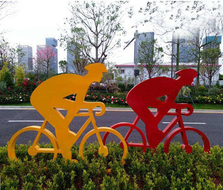 城市不锈钢骑单车人物雕塑图片
