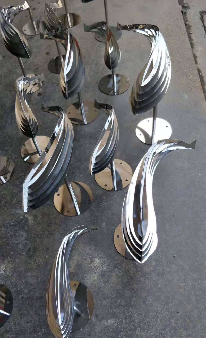 不锈钢镜面鱼群动物雕塑图片